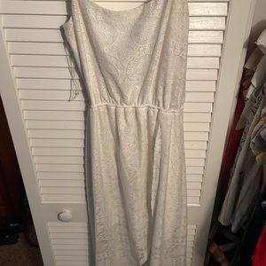 White Lacey spaghetti strap dress. Short in the front long in the back.